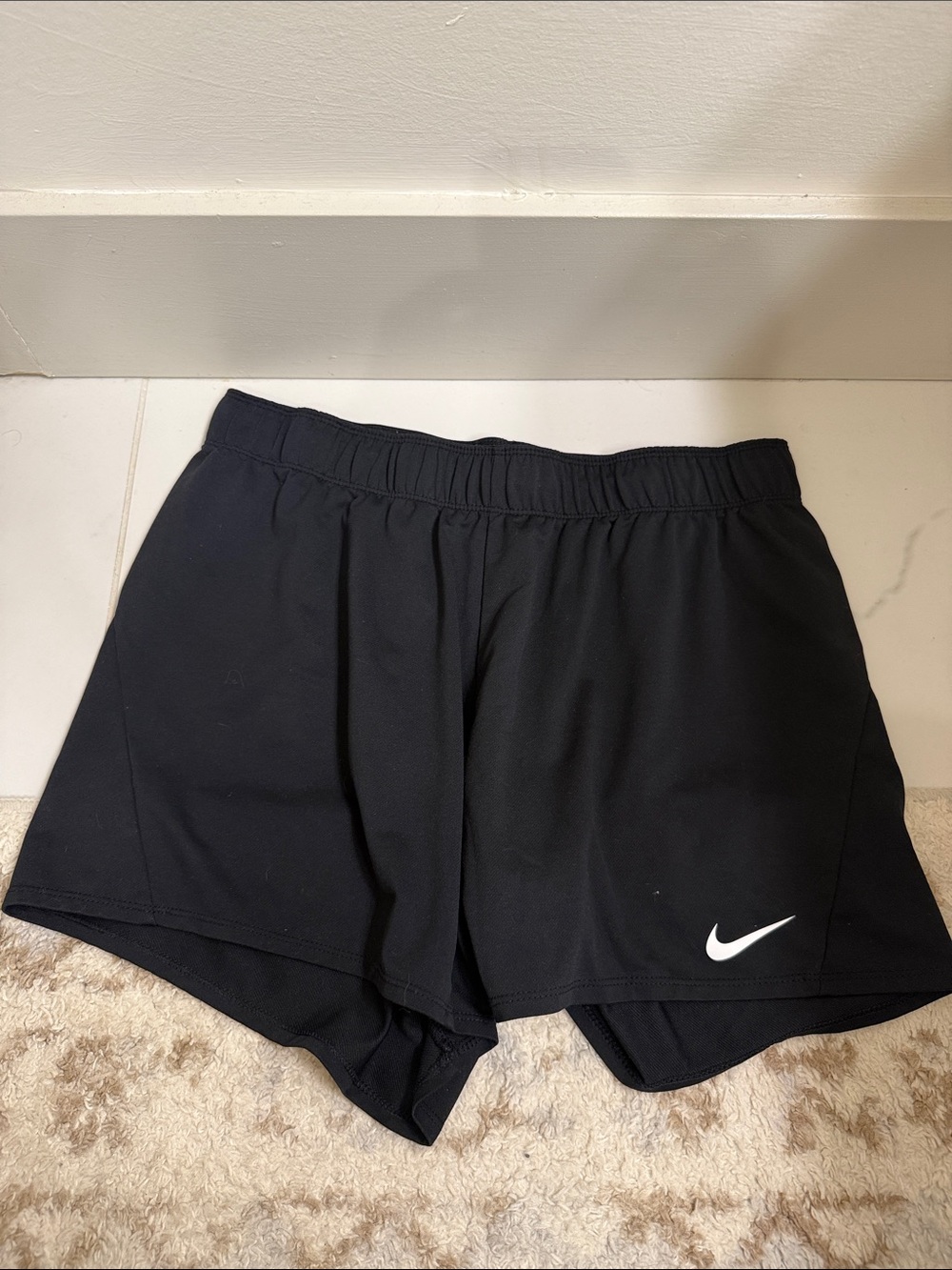 Nike Women's Black Athletic Shorts with White Swoosh Accent